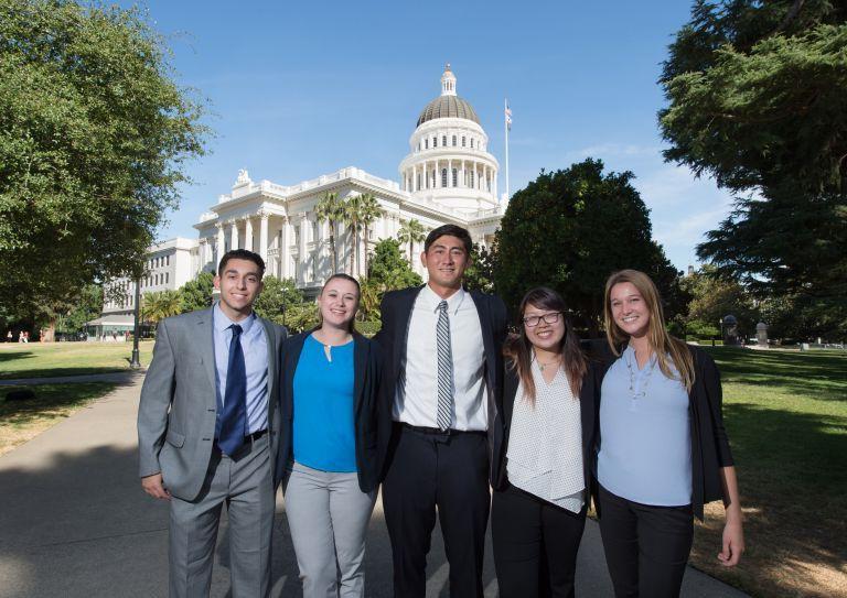 Students standing in front of Capitol building 