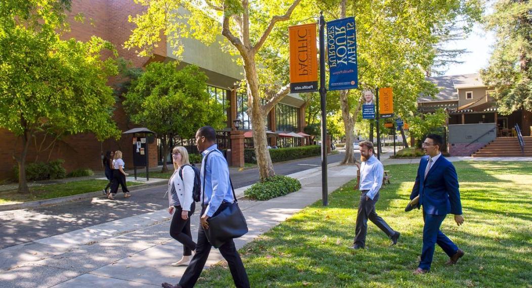 students walk on the Sacramento campus